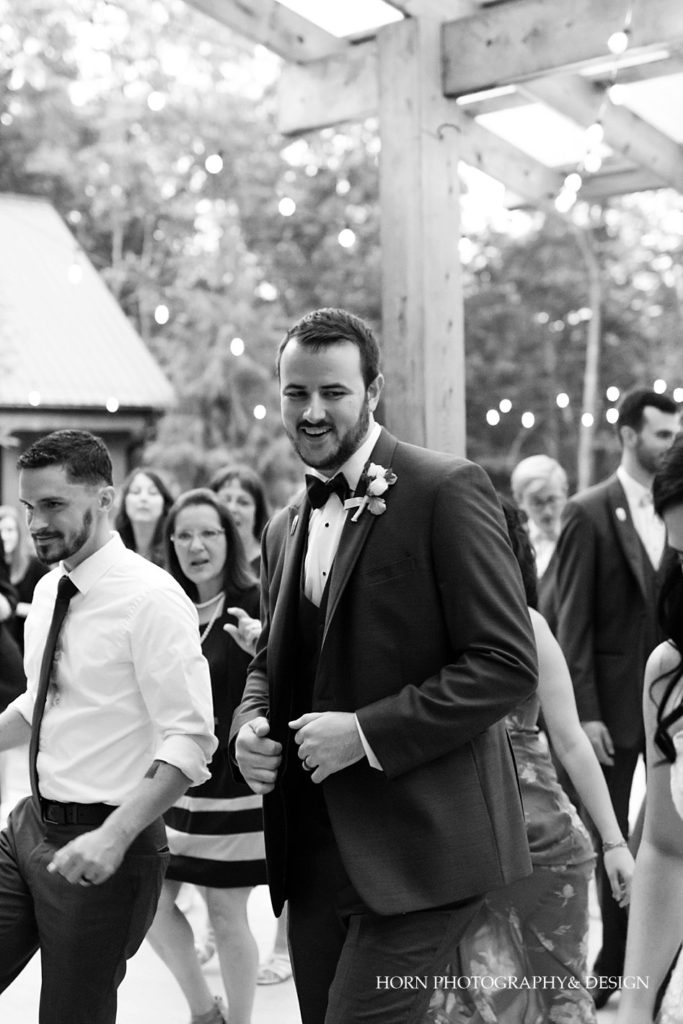groom dancing black white photography 