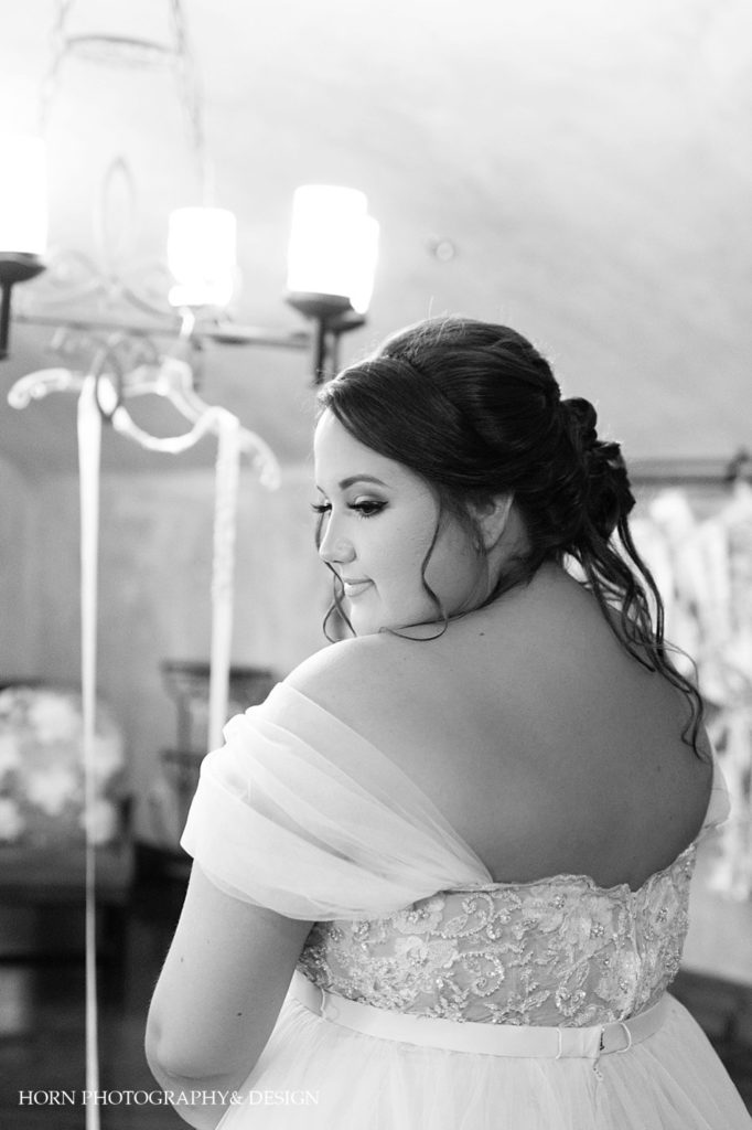 black and white bridal photo from behind bridal updo with curls horn photography and design