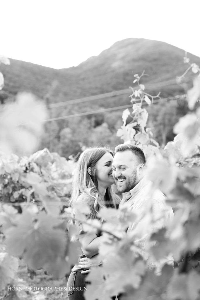 black and white candid engagement photography pose in mountain vineyard Atlanta Georgia horn photography and design