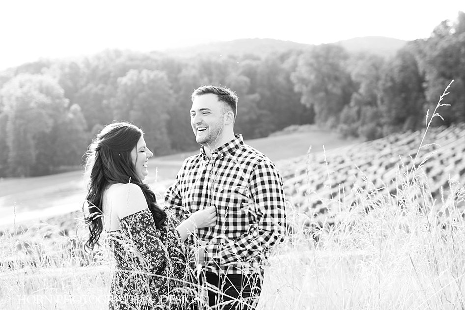 black and white candid laughing in the vineyard photo off should dress checkered shirt wheat grass Georgia Mountains horn photography and design
