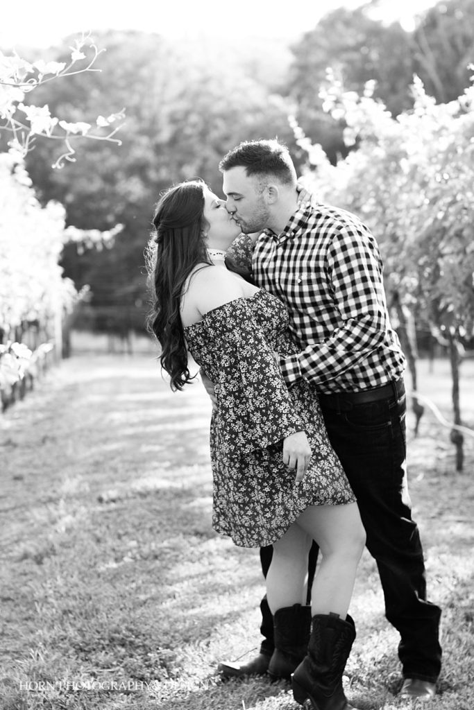 black and white couple photo session in vineyard dancing dip kiss Southern Love and charm horn photography and design