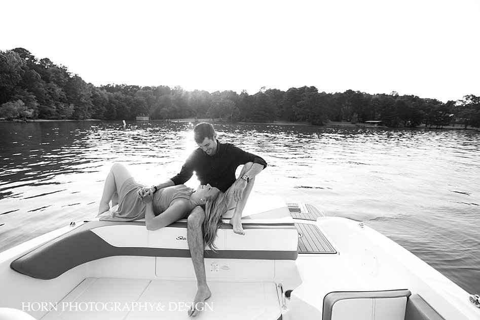 black and white engagement photos on a boat on Lake Lanier pose ideas horn photography and design