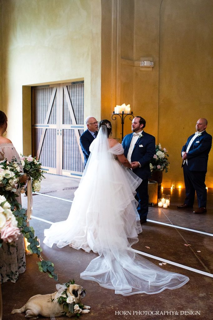 bride and groom saying vows over shoulder photo rustic wedding Montaluce vineyard and winery horn photography and design