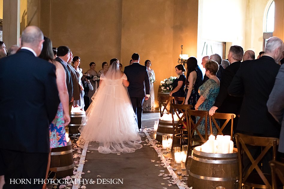bride entrance escort down aisle from behind photo Montaluce vineyard winery horn photography and design