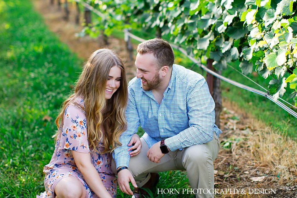 candid laughing sweet couple pose North Georgia Vineyard horn photography and design