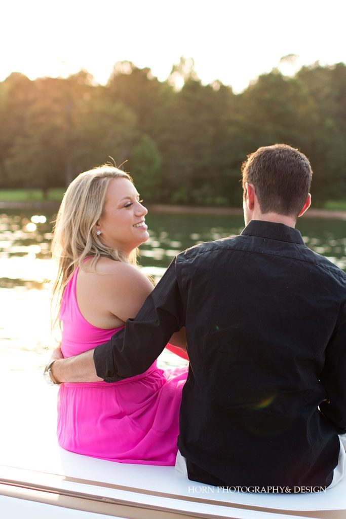 candid of-the moment Lake Lanier engagement photography on the water Southern Charm horn photography and design