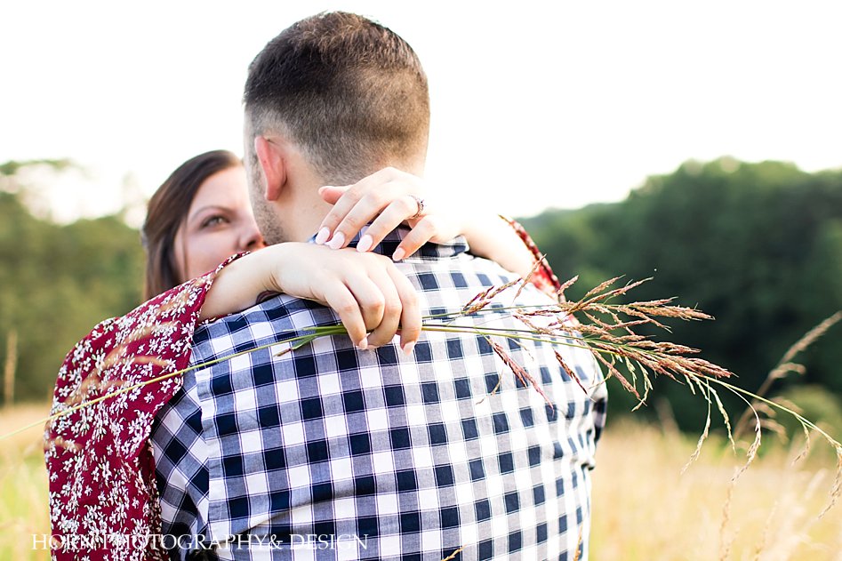 couples photography poses hands around the neck engagement ring and wheat in hand Georgia Vineyard horn photography and design