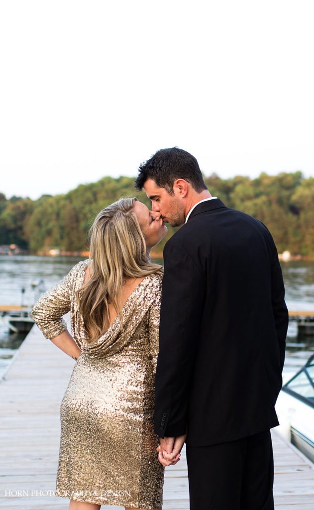 Lake Lanier engagement photo on the water blissful kiss pose formal wear gold dress horn photo and design
