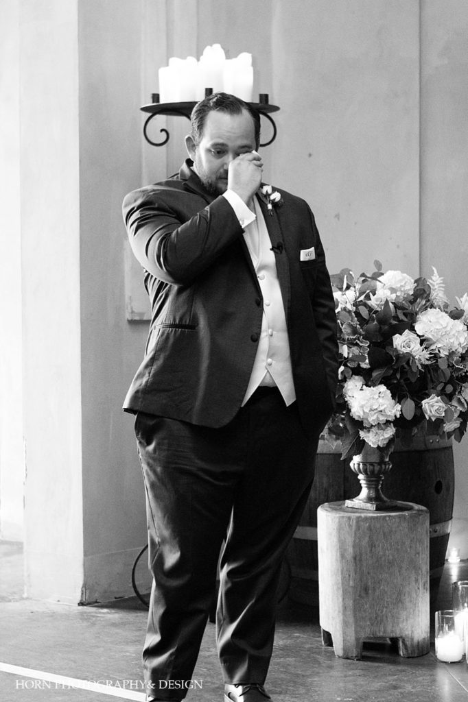 groom black and white tears of joy seeing bride walk down aisle June Southern wedding horn photography and design