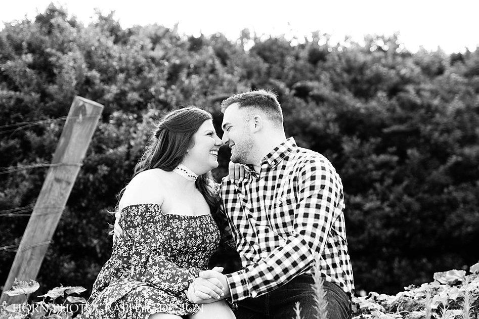 rustic outdoor scenery engagement photo noses touching black and white photo Georgia Mountains horn photography and design