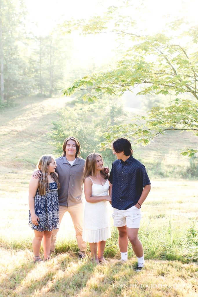 candid outdoor family photo blue gray and white outfit ideas blue paisley pattern dress Dahlonega GA horn photography and design