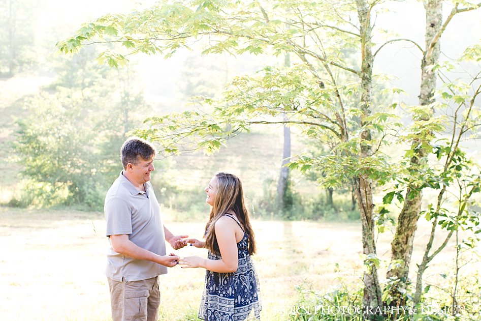 candid outdoor wooded area family photo session father daughter laughing North Georgia horn photography and design