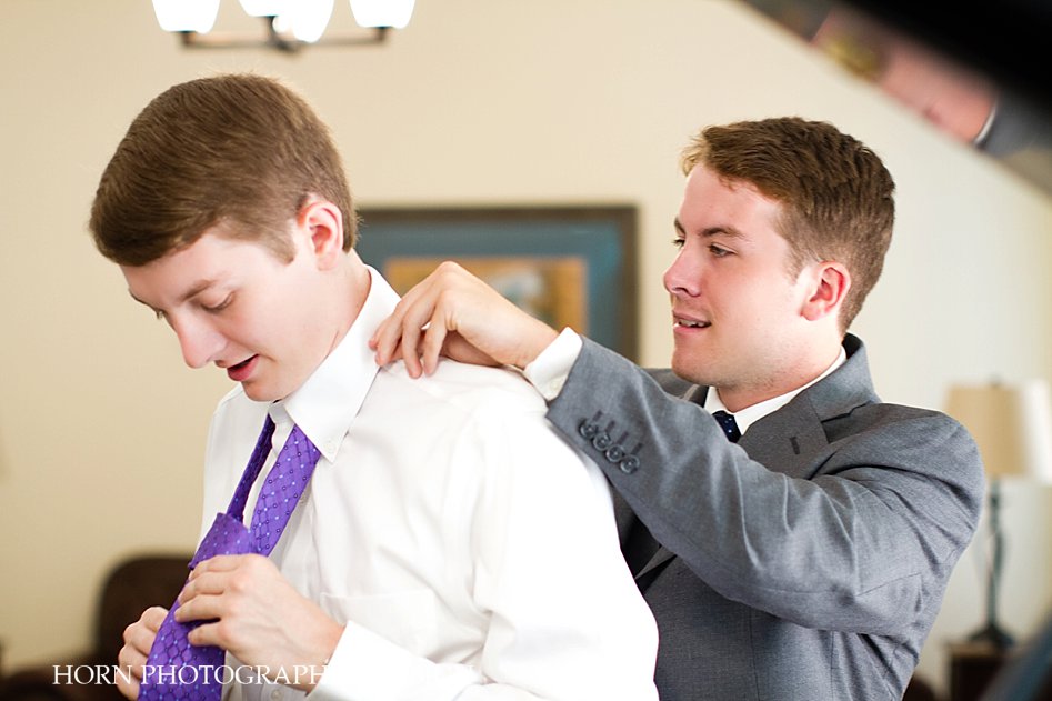 groom getting ready with groomsmen grey suit purple neck tie horn photography and design