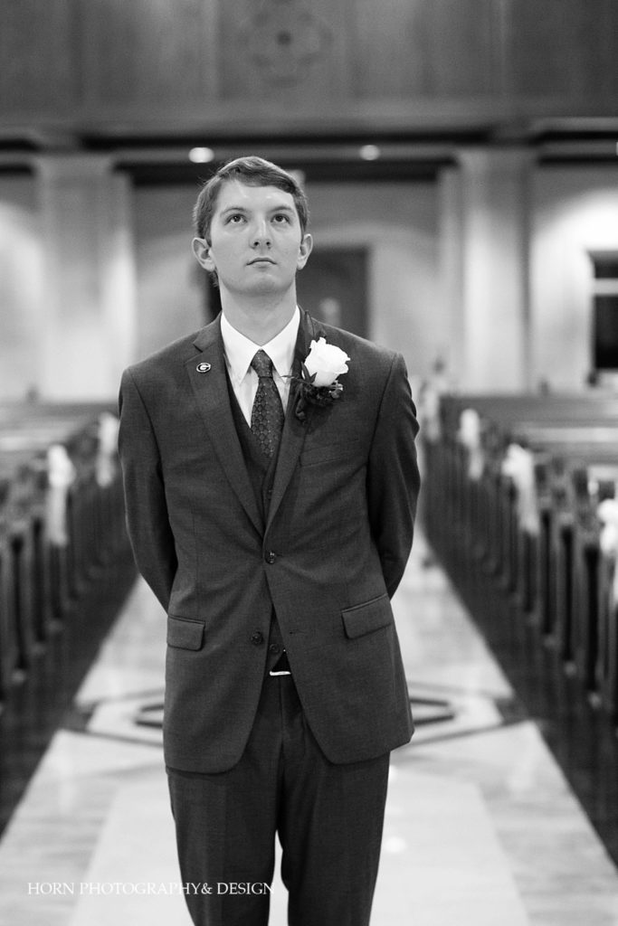 black and white groom first look photo DSLR camera horn photography and design