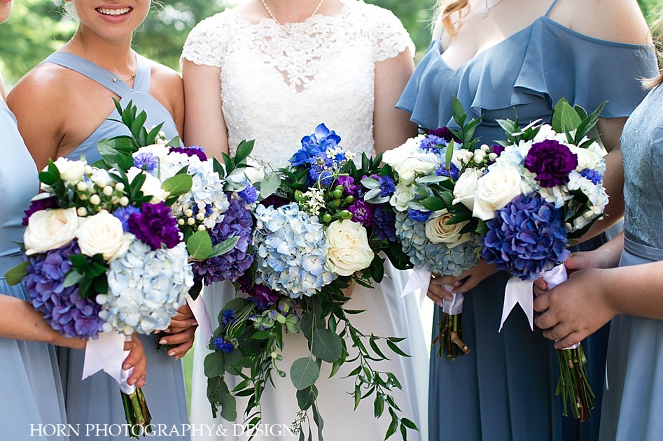 wedding day bouquet ideas purple blue hydrangeas white roes peonies eucalyptus leaves blue bridesmaid dresses lace cap sleeve wedding dress horn photography and design