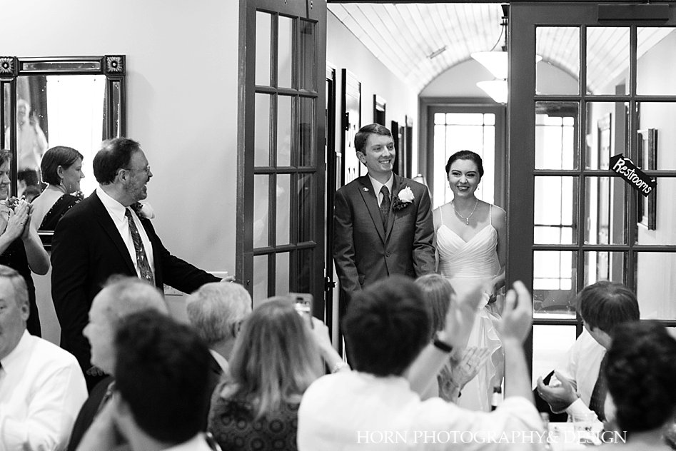 black and white bride and groom enter reception Atlanta Georgia Weddings horn photography and design