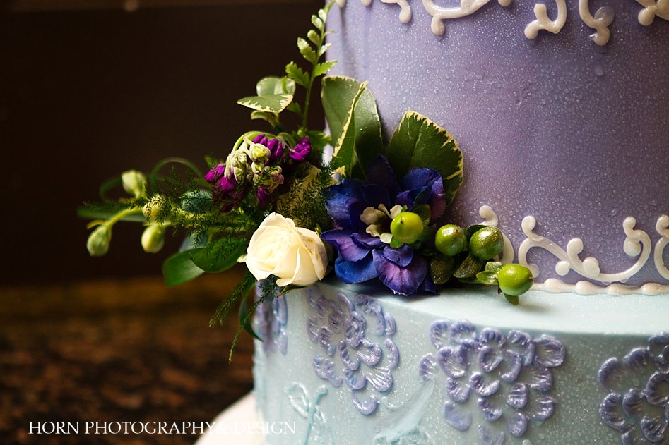 multi tier wedding cake with floral details purple blue white wedding cake horn photography and design