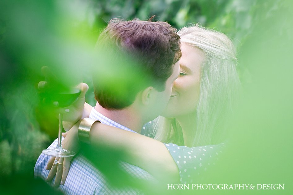 kissing through the trees engagement photo The Cottage Vineyard Cleveland GA horn photography and design