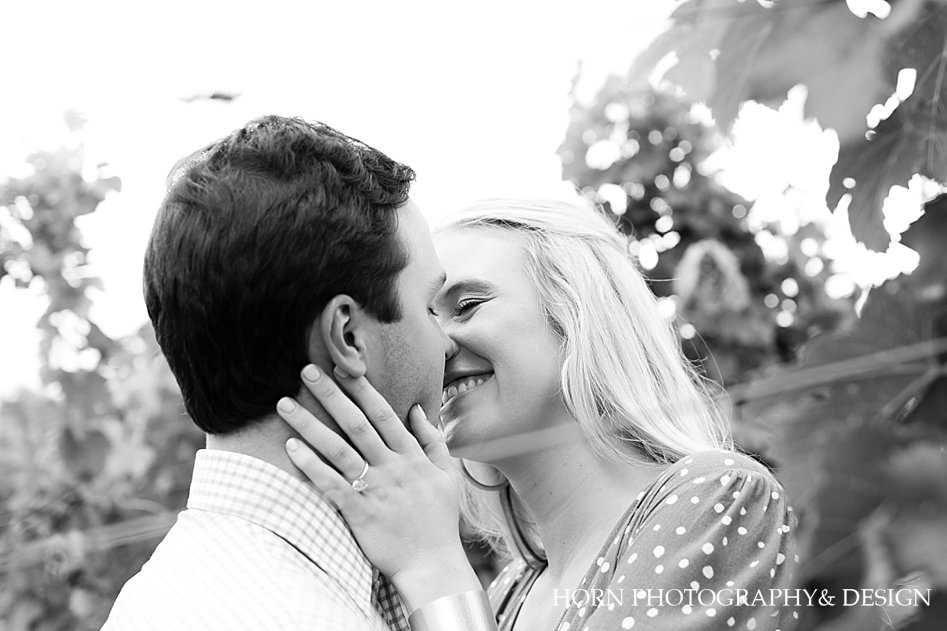sweet embrace black and white photo engaged couple kissing see the ring Mountain Vineyard horn photography and design