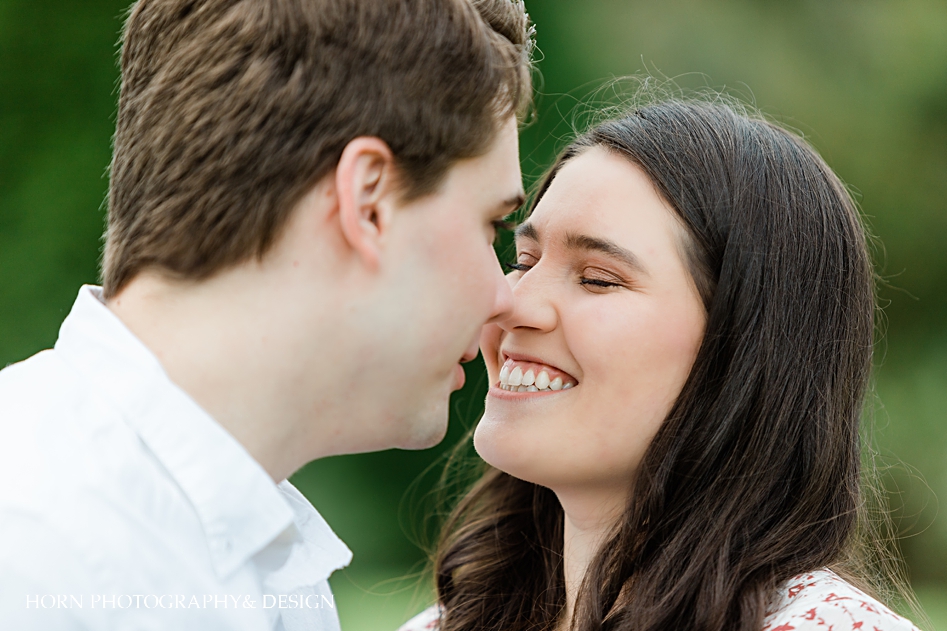 close up of catholic couple nose nuzzling 