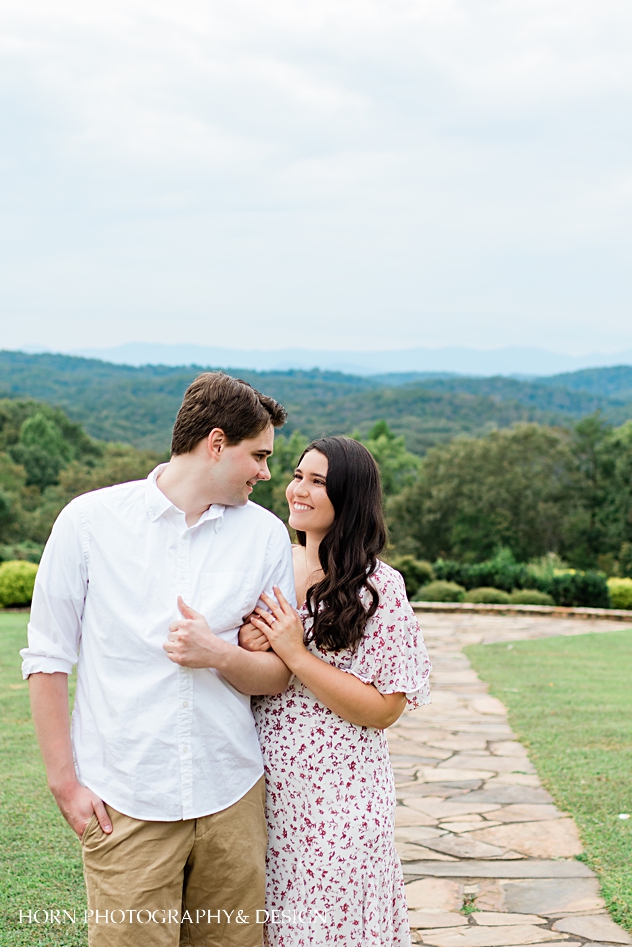 girl and guy pose blue mountain vineyards engagement