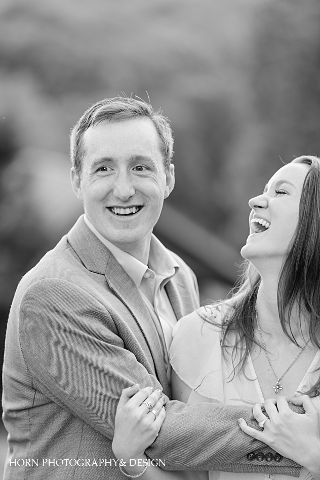 black and white photo of engagement shoot groom in focus