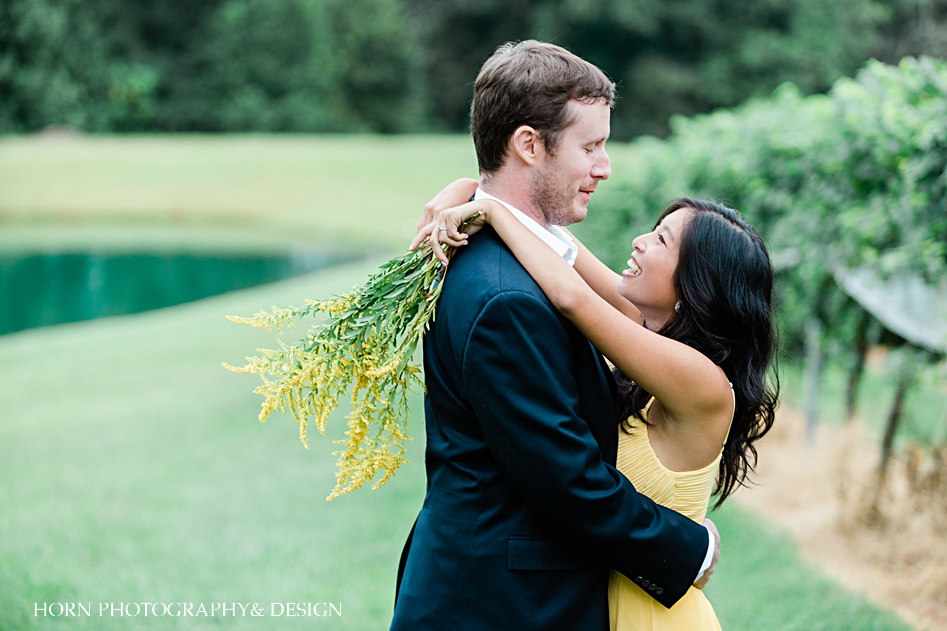 bride holds yellow flowers with yellow dress engagement session