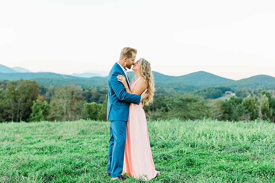 blue mountain range dahlonega photography shoot anniversary blue suit pink dress kissing