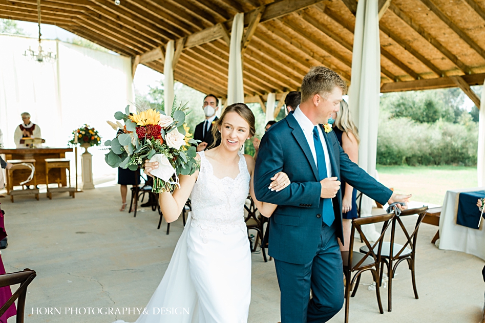 bride and groom walk down aisle catholic wedding Monroe ga