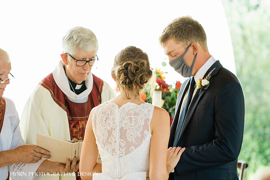 Catholic bride and groom exchange rings