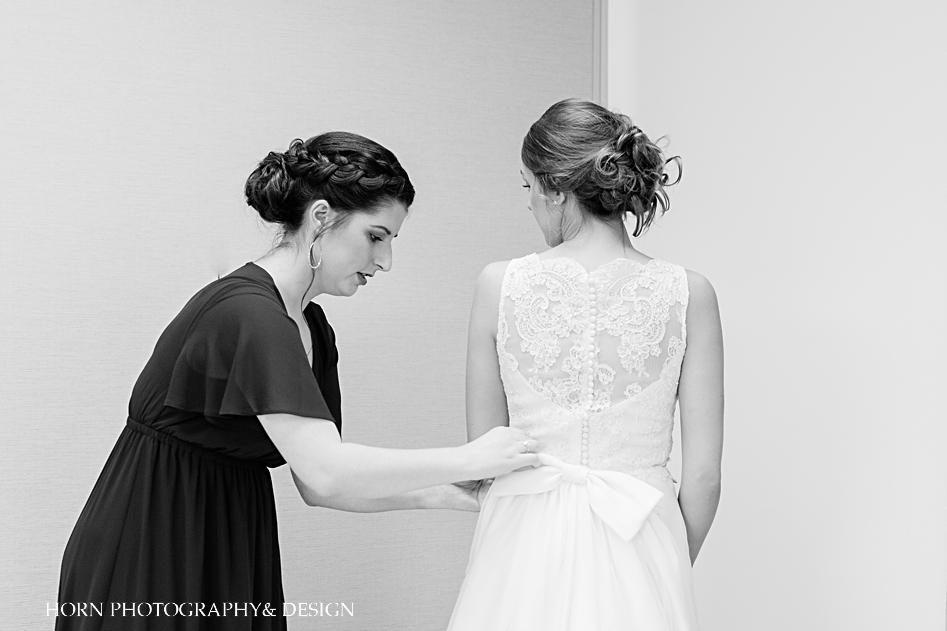 maid of honor helping bride