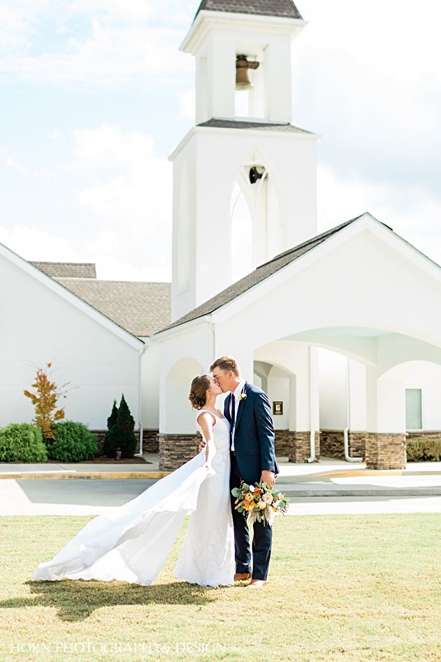 st Anna Catholic Church Monroe ga wedding  couple kissing in front of church