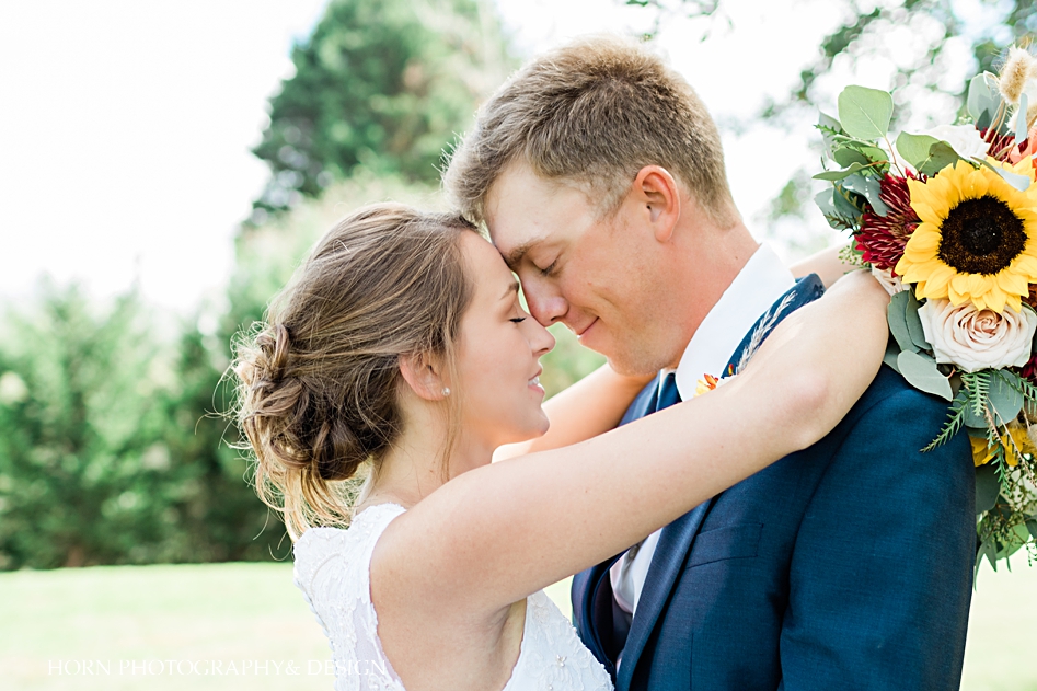 wedding couple embraces