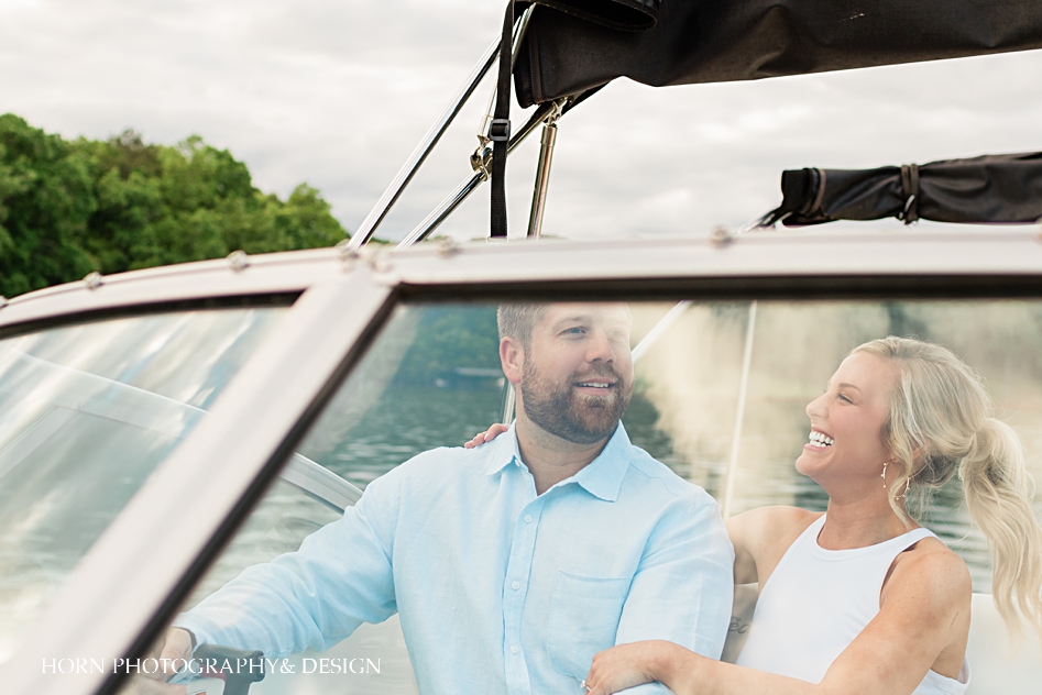 engaged couple on cabin cruiser