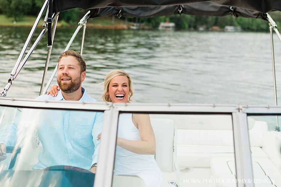 Couple laugh on boat dahlonega photographer husband wife team