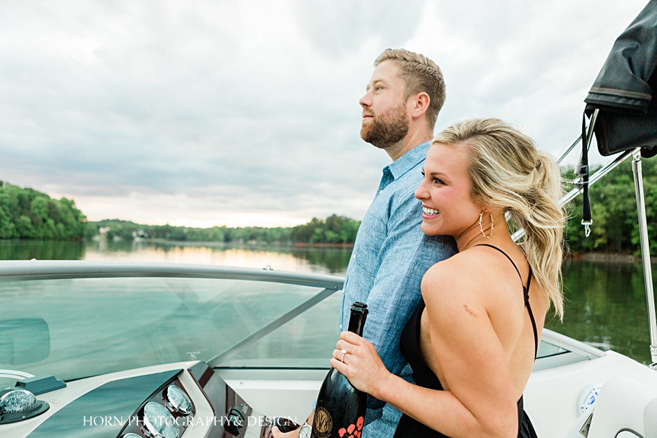 engagement shoot on boat in lake Lanier chestatee couple drive boat