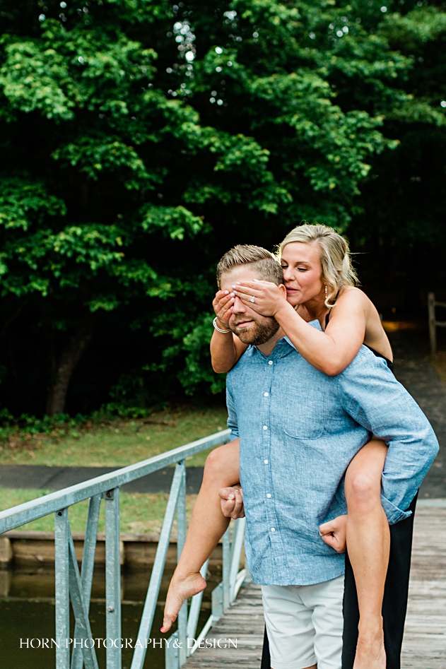 Bride covers groom's eyes engagement session