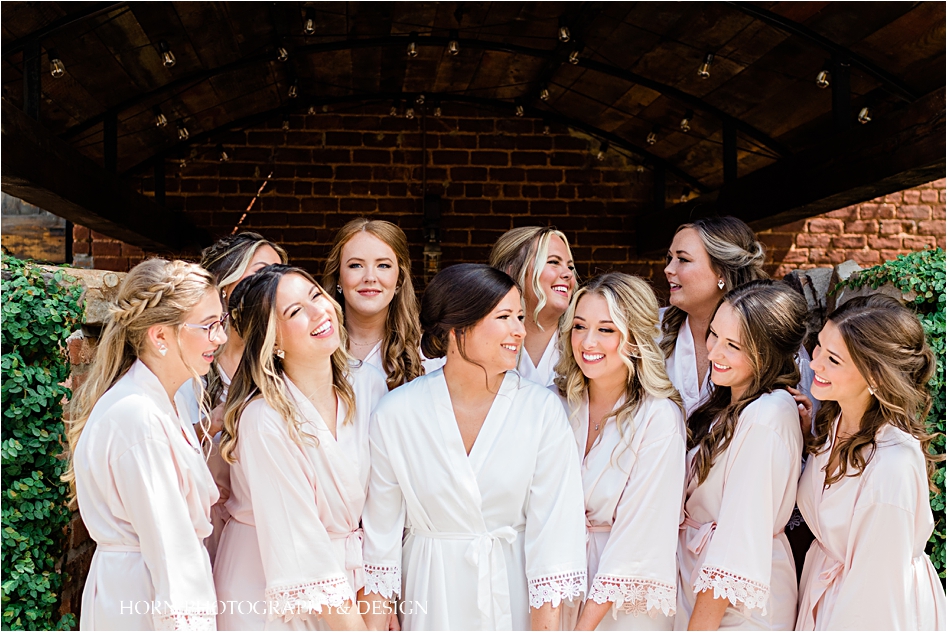 Bridal party in robes  Cigar Warehouse Wedding Horn photography and design pink robes